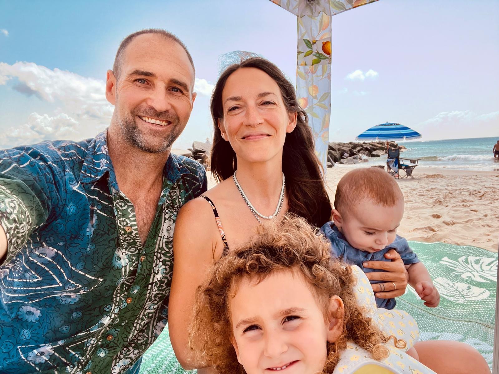 Chrissy Beth with her family on a beach.